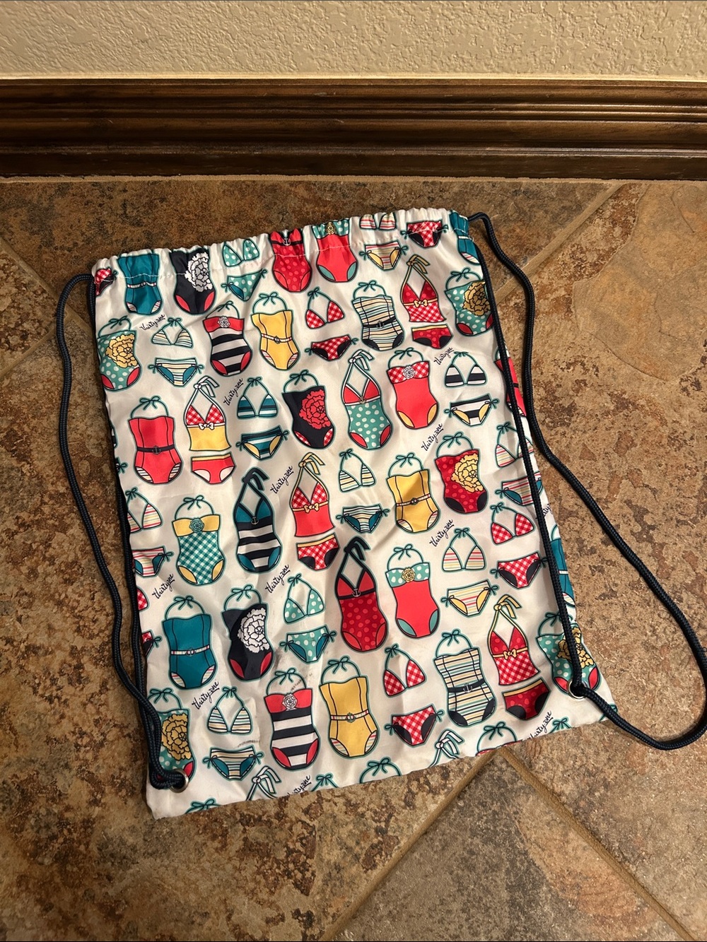 Swimsuit Print Drawstring Backpack in White with Multi-Color Swimwear Motif